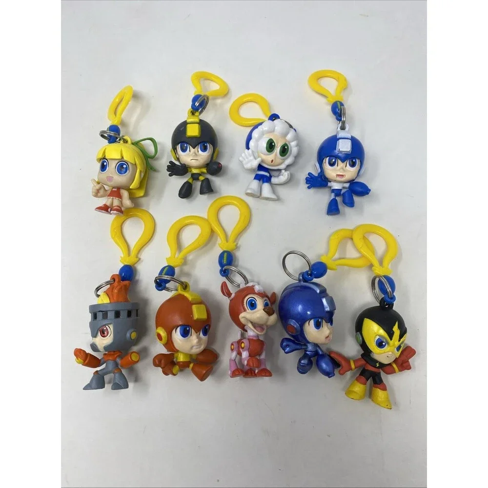 lot of 9 CAPCOM MEGA MAN BACKPACK HANGERS METALLIC FIRE MAN JUST TOYS INTL.